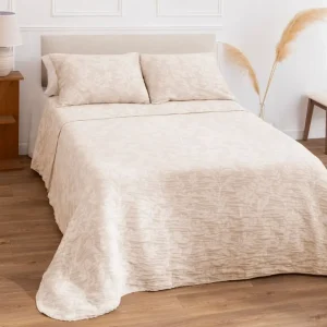 Colcha reversible con diseño floral en relieve